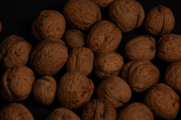 heaps of walnuts,Lots of walnuts top view, texture and background of walnuts, selective focus 