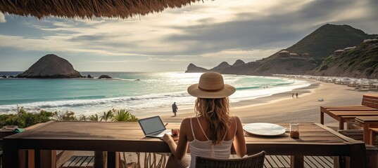 Remote work  young woman freelancing on beach, using laptop for distance work and vacation - obrazy, fototapety, plakaty