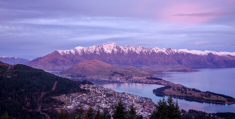 Remarkables mountain range and Queenstown during sunset photot taken from Bobs Peak.