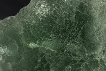 Detailed View of Translucent Fluorite Crystal, Showcasing its Luminous Green Color