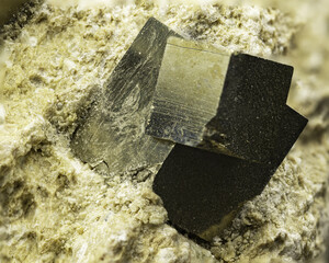 Shining Pyrite Mineral on Matrix, Showcasing Metallic Luster and Natural Form