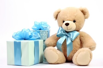 a bear sits next to blue gifts baby