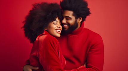 Portrait of a young black couple hugging, smiling in red clothes on a red background. A man and a woman in love are enjoying Valentine's Day. The concept of a romantic relationship for a photo shoot. - obrazy, fototapety, plakaty