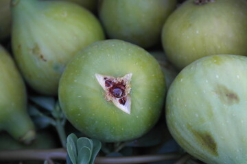 Natural green fig with honey flowing inside