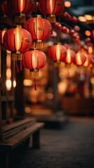 Chinese red lanterns hanging outdoors at dusk, offering a warm, festive glow for Lunar New Year...