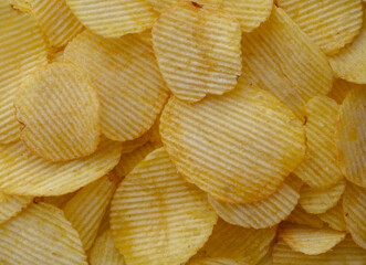food background from delicious chips poured out of a pack 2