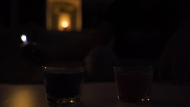 Lighting candle, dark house.