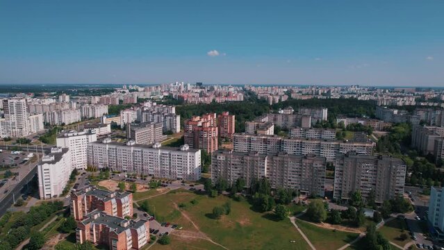 Aerial view of a residential microdistrict with large parking lots for cars and green recreation areas