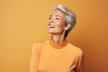 medium shot portrait photography of a pleased woman in her 50s against a light orange background