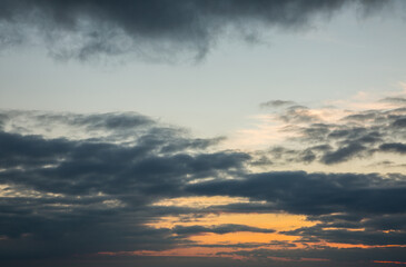 Beautiful orange sunset with big rain clouds