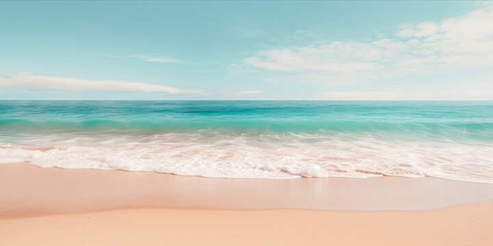 A pristine beach with turquoise waters, foamy waves, and a soft sandy shore under a blue sky with fluffy clouds.