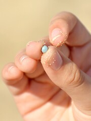 hand with beads