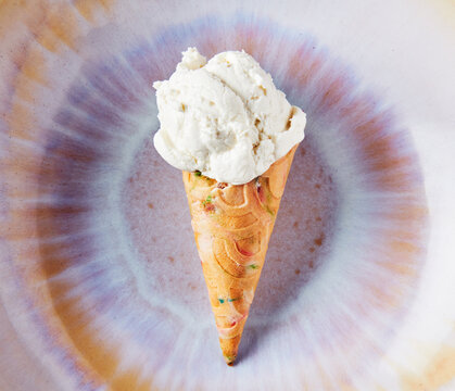 Vanilla ice cream cone with sprinkles