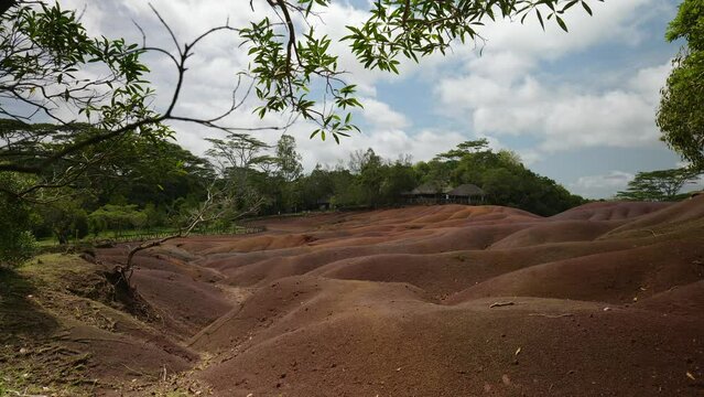 A vivid handheld view of Chamarel&rsquo;s Seven Colored Earths in Mauritius, where multicolored volcanic sands and rolling textured formations reveal one of the island&rsquo;s most iconic natural wonders.
