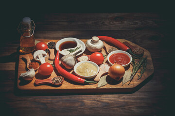 Various sauces and spices on the table, ketchup, mustard, garlic and various spices, still life with products