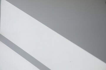 Shadow from window on white wall indoors