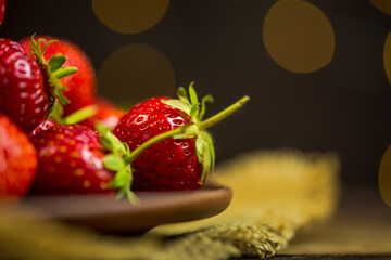 Red strawberries and beautiful background with blur