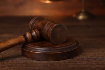 Law concept. Judge's gavel on wooden table, closeup