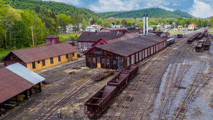 An Aerial View of a Narrow Gauge Train Yard, With Coal Hoppers, Shops and Roundhouse, on a Sunny Spring Day