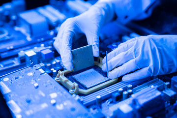 process of Installation of processor in CPU socket, hands in gloves holding chip - obrazy, fototapety, plakaty