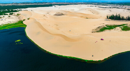 Stark geographical contrast between sand and water near Mui Ne, Vietnam. Mui Ne Desert of Vietnam...