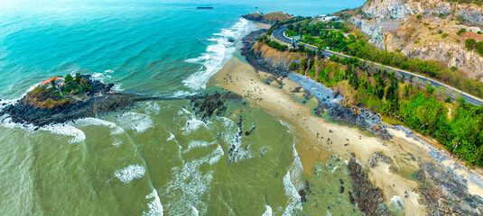 Aerial view of Hon Ba island in Vung Tau city, Vietnam. On full moon day of lunar calendar, when tide is low, people can walk across island to visit temple on mountain. Spiritual travel concept. - obrazy, fototapety, plakaty