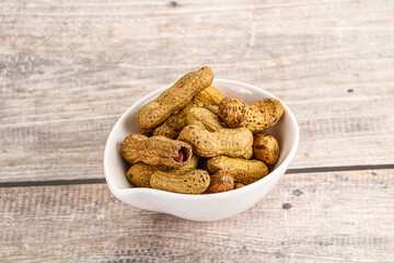 Raw ripe unpeeled peanut heap