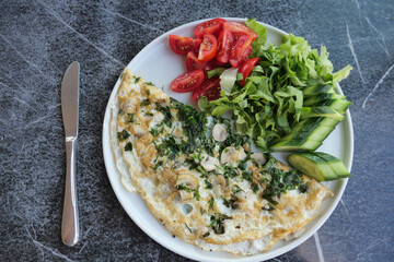 top view of herb Egg Omelette on table 
