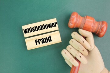 judge's hammer and stick with the word whistleblower fraud. the concept of giving wrong information