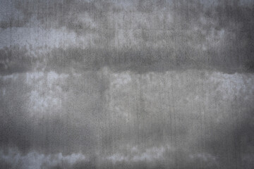 The background of the old wall is made of fine sand, smoothly plastered, with flakes clinging to it. The background is an abstract wall texture.