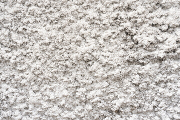 Background of an old wall with splashed cement pattern and white paint. Abstract wall texture backdrop