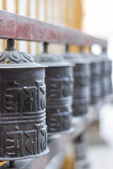 Prayer wheels is spun by devotees to aid for meditation and accumulating wisdom, good karma and...