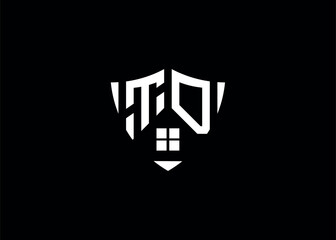 Real estate letter TD shield shape logo and house building vector template