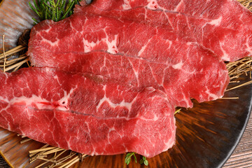 Close-up beef raw red steak on wooden board background.Meat texture.