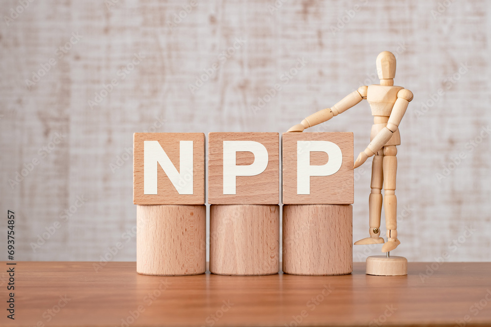 Poster there is wood cube with the word npp. it is an abbreviation for net primary production as eye-catchi