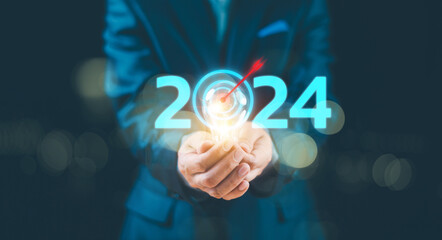 Start calendar 2024 plan concept. Businessman show light blub action target business trend...