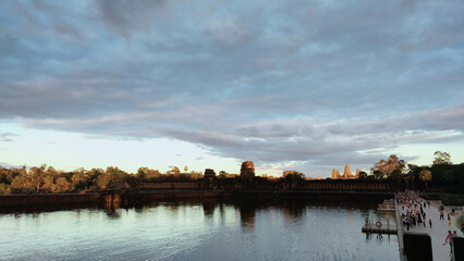 sunset over the river at angkor wat