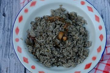 Nasi Cumi Hitam, black squid rice, rice cooked with squid ink. Indonesian food. 