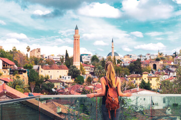 Fototapeta premium Woman travelling in Turkey, viewpoint of Antalya city with minaret- Turkey