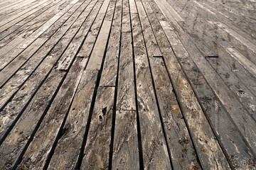 Harbour dock floorboards, old floorboards in perspective, brown wood decking with gaps,.