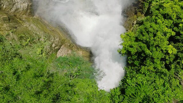 Aerial survey of waterfalls in Lake Sebu, the Hikong Bente Falls. Mountain forest, lush green plants and trees surrounding. Mindanao, Philippines.
