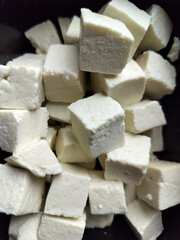 White fresh raw Dairy product Cheese or Paneer display close view.