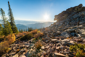 Sun Rising Over Rocky Outcrop