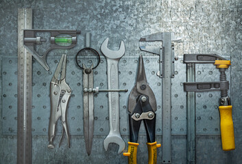 Set Of Construction Tools On Metalic Background.
