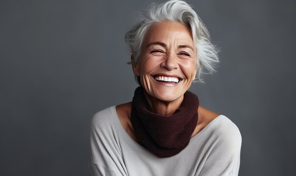 An Older Woman Smiling On The Beach