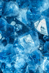 Blue Crystal Mineral Stone. Gems. Mineral crystals in the natural environment. Texture of precious and semiprecious stones. Seamless background with copy space colored shiny surface of precious stones