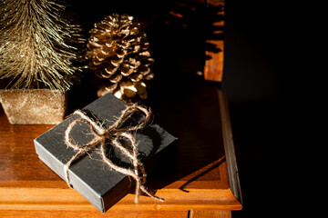 Small black gift box tied with string