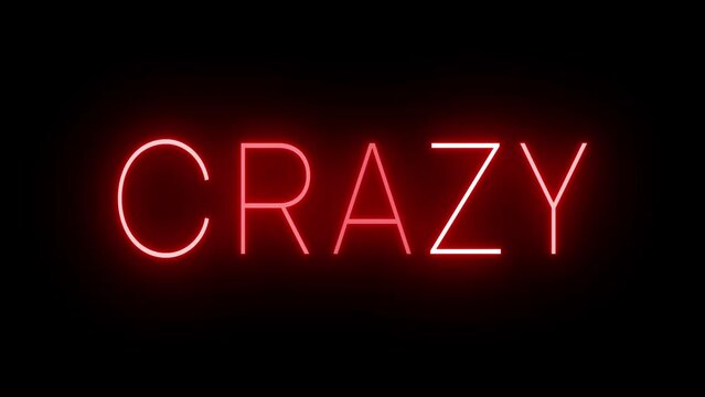 Flickering red retro style neon sign glowing against a black background for CRAZY