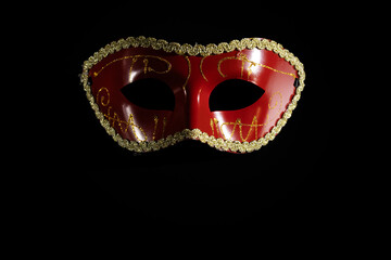 Carnival mask, a theatrical and vintage piece for a stage event, black background