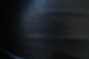 Black background. Leather car seat covers and sofas.